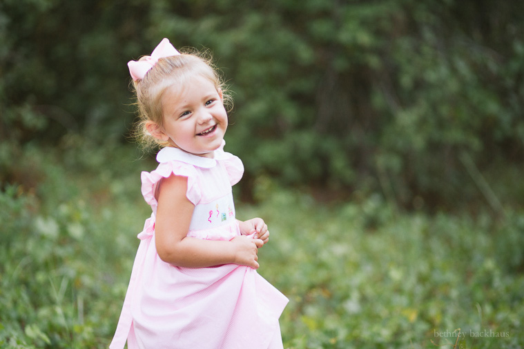 Little girl laughing during photo shoot